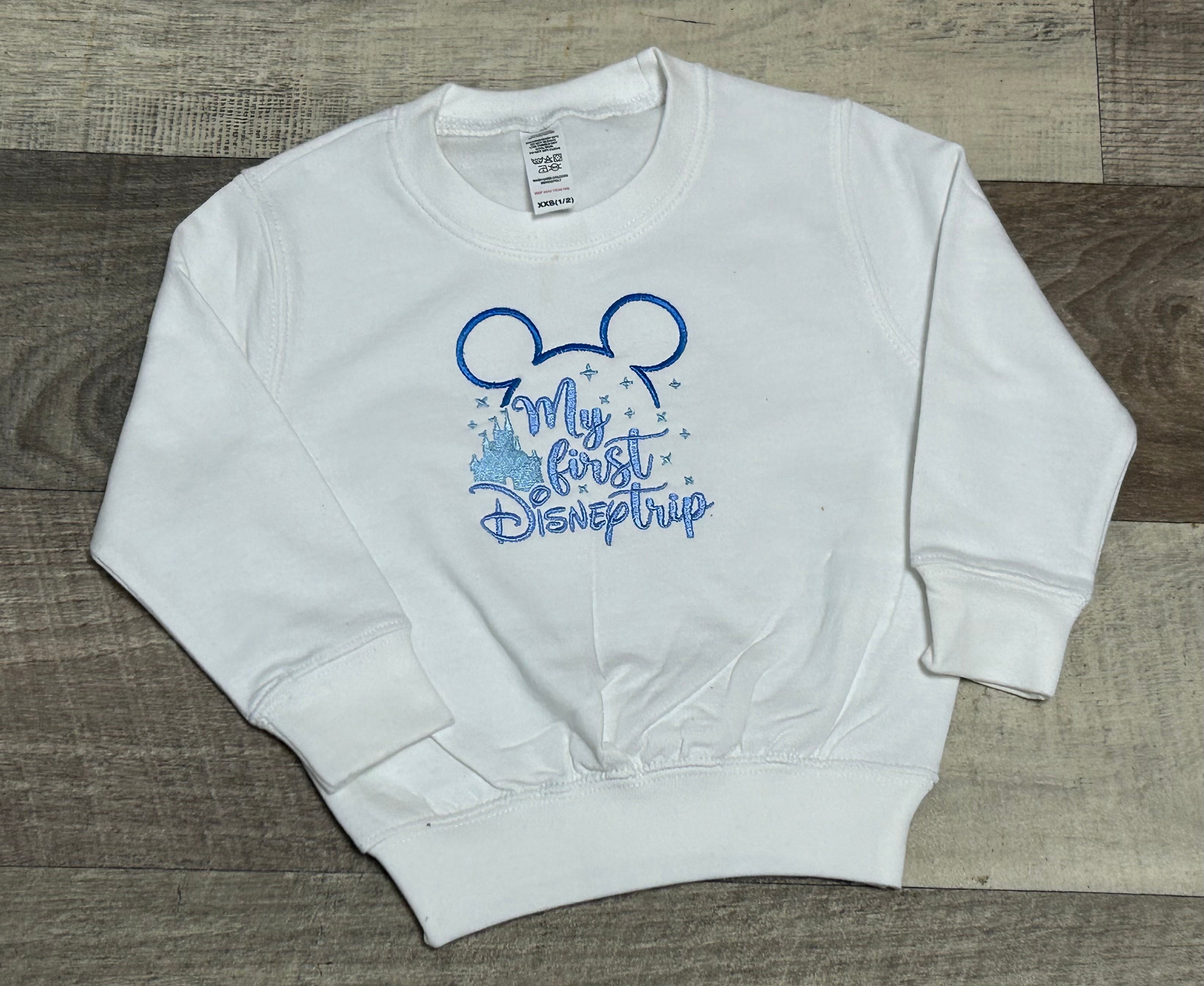 White embroidered first disney trip sweatshirt