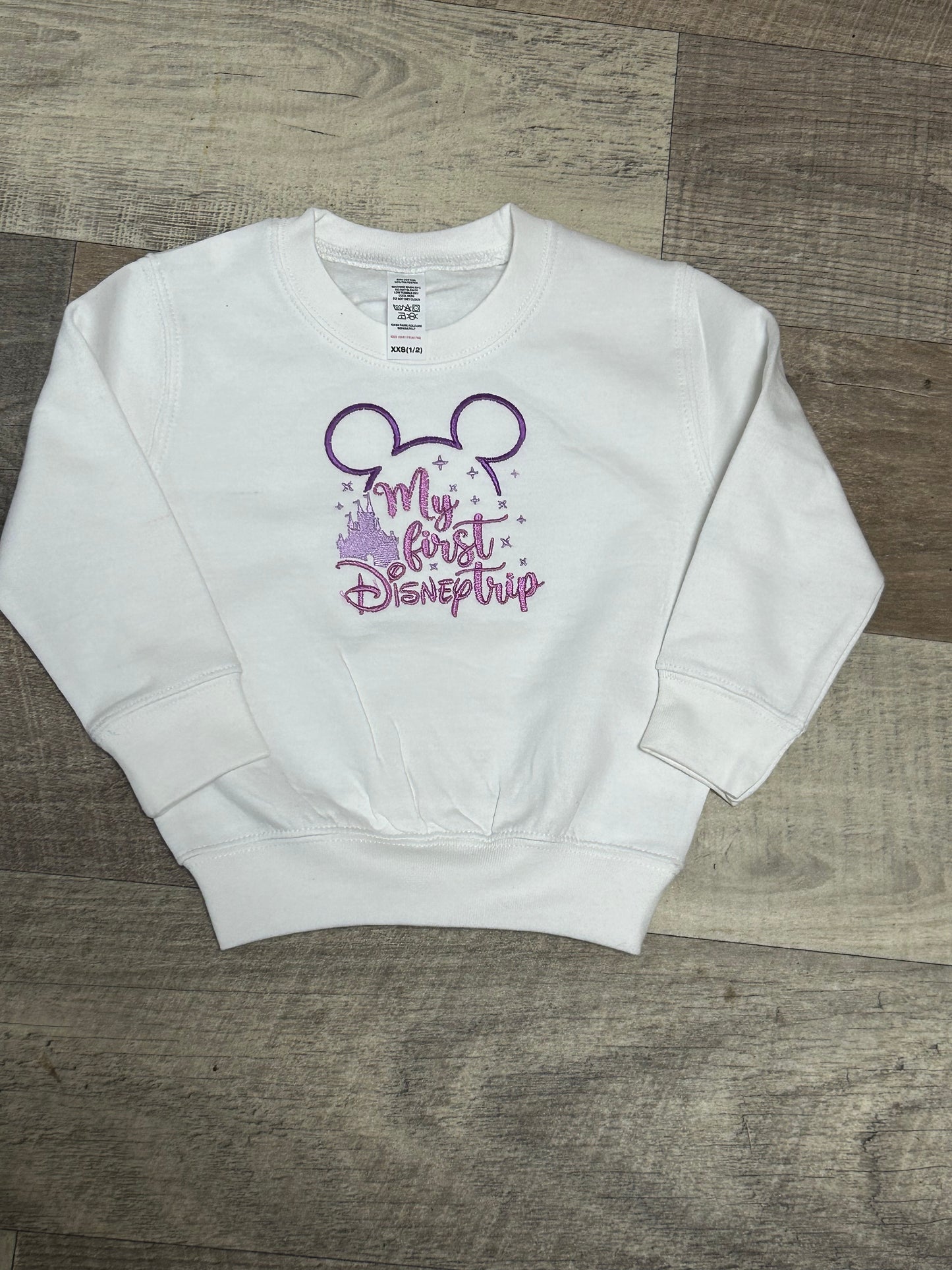 White embroidered first disney trip sweatshirt